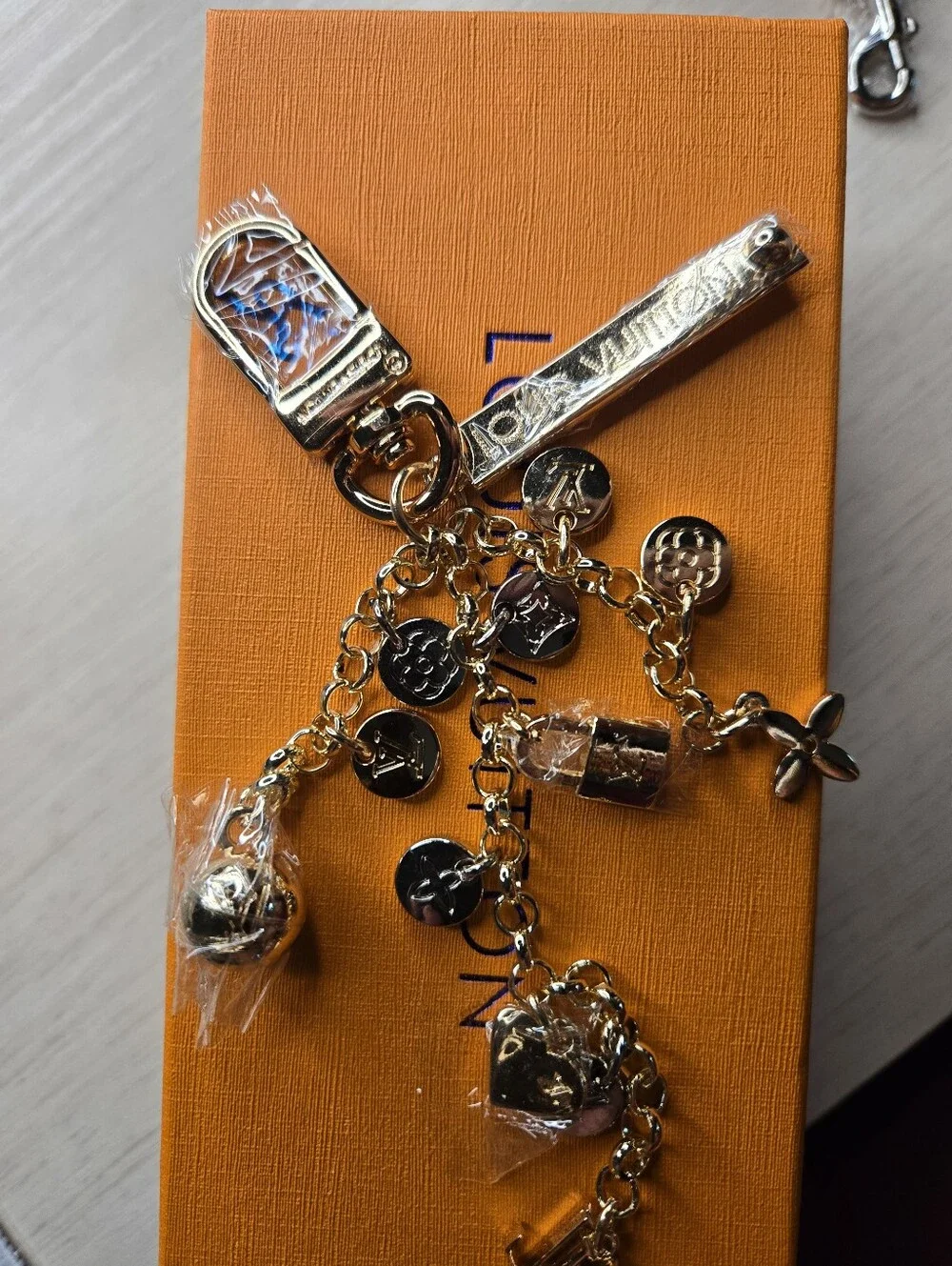 Louis Vuitton Gold-Tone Charm Keychain - Gold